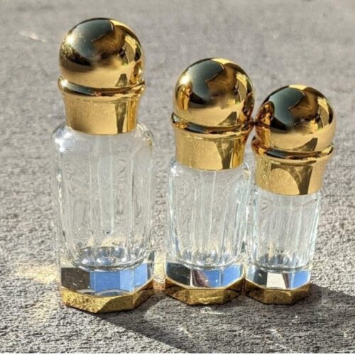 Refillable glass attar bottles, specifically designed for storing and dispensing traditional concentrated perfume oils like attar, ittar, oud, and essential oils. 
